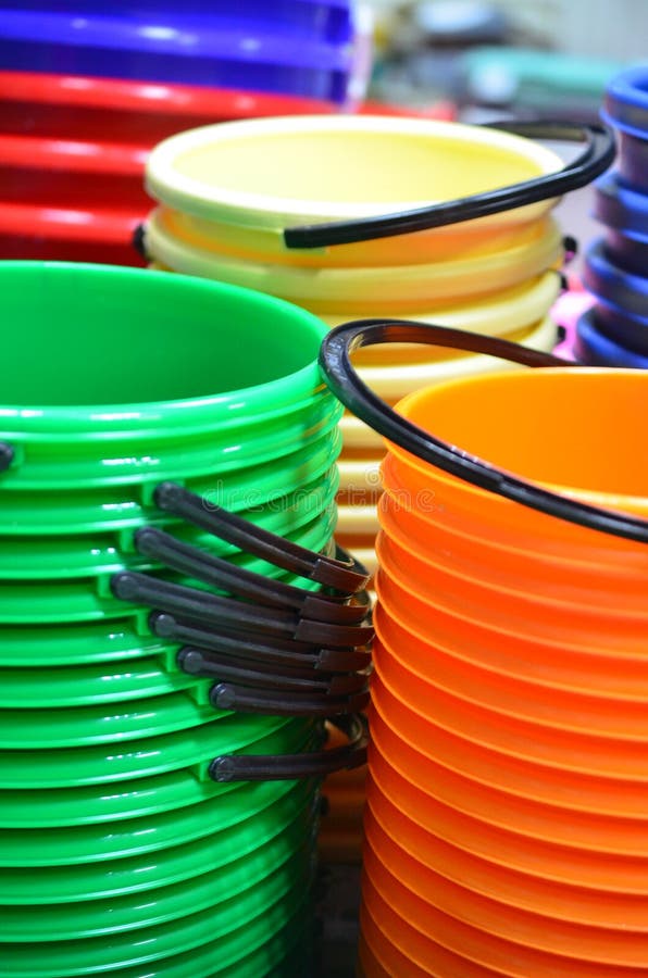 A Stack of Multicolored Plastic Buckets. Stock Image Image of round