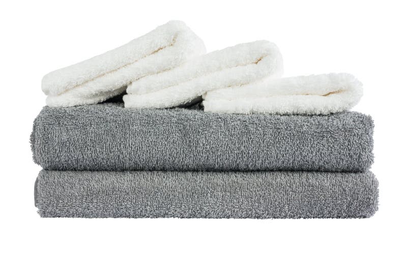 Stack of grey and white bath towels. Isolated over white