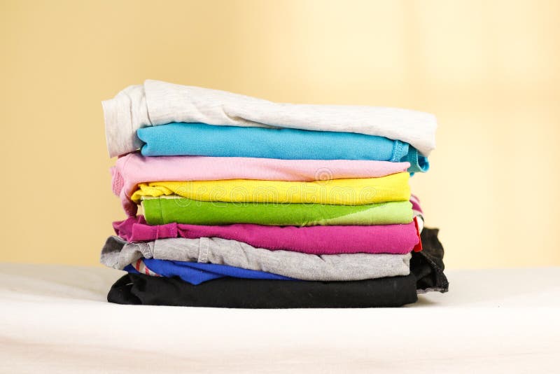 Stack of Ironed Colored Linen. Pile of Clothes. Ironing Concept. Stock ...