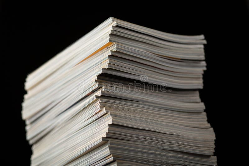 Stack of magazine isolated on black background with shallow depth of field. Stack of magazine isolated on black background with shallow depth of field.