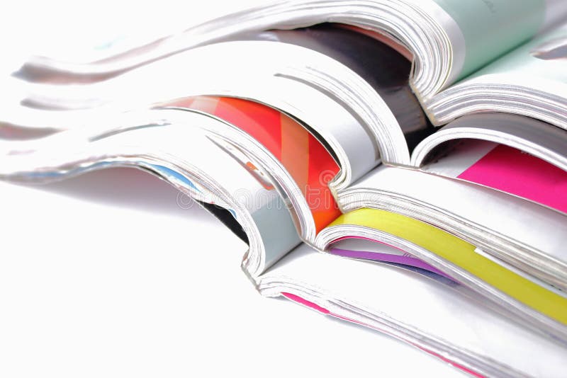 Stack of magazines on white background