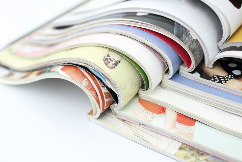 Stack of magazines on white background