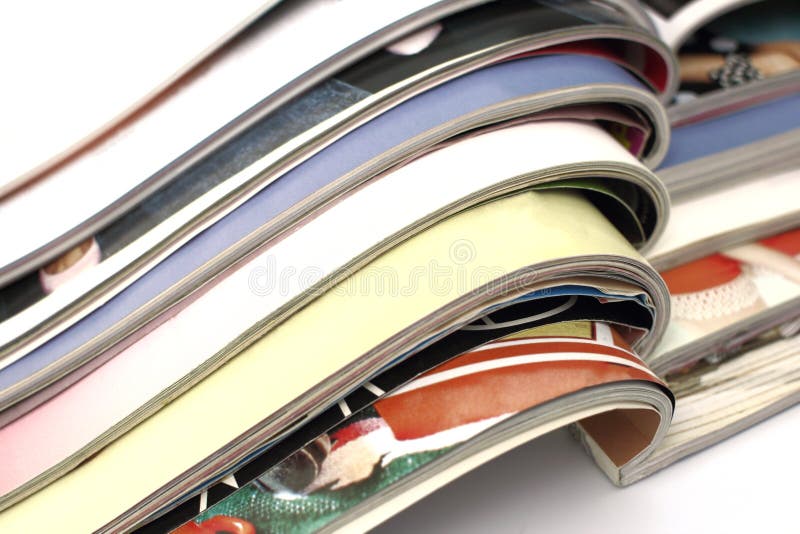 Stack of magazines on white background stock images