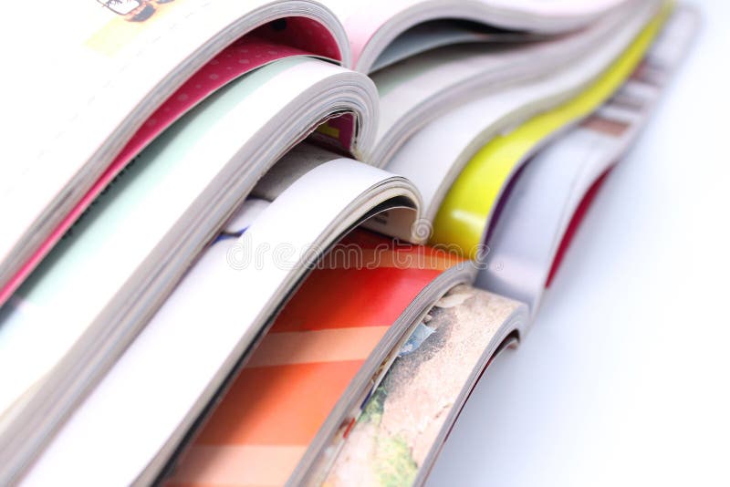 Stack of magazines on white background