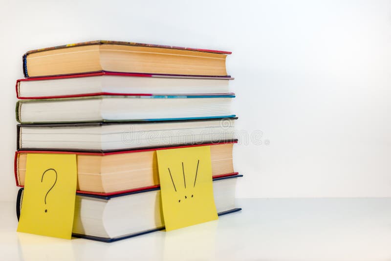 Stack of old books - question and answer stock photos