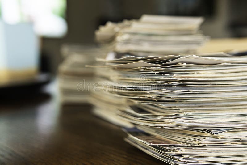 Stack of old photo prints and Memories to be digitized a