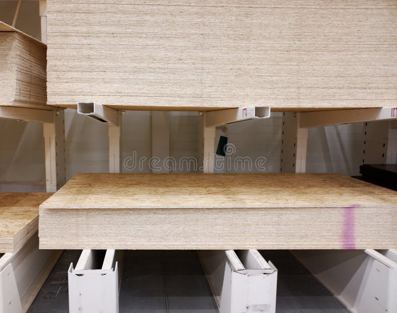 A Stack of Osb in a Hardware Store on Racks. Construction and Repair