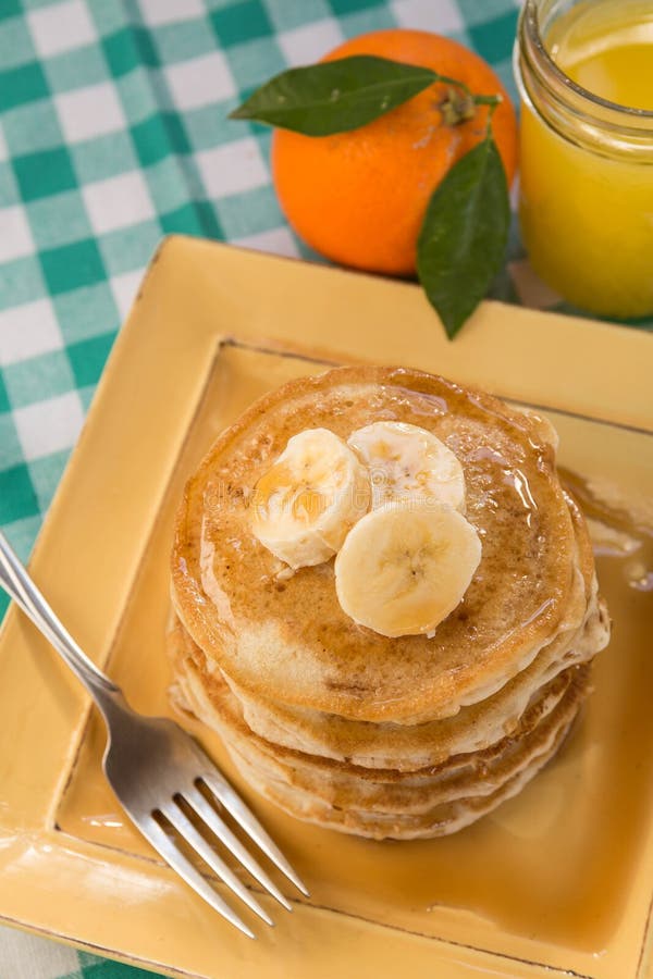 Breakfast Buttermilk Pancakes with Syrup and Fresh Orange Juice Stock