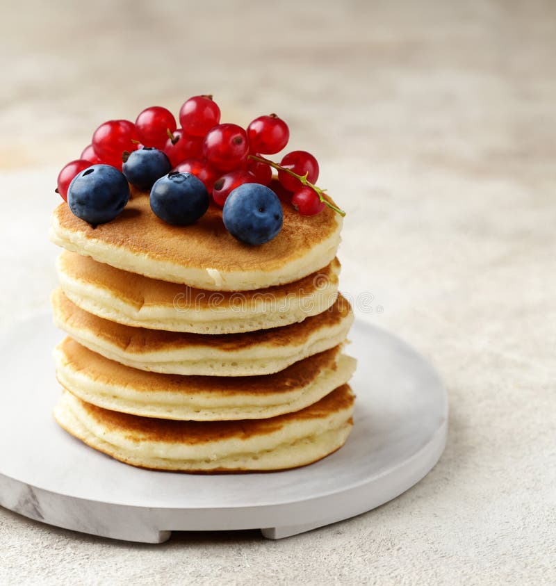 Stack of pancakes with fresh berries stock image