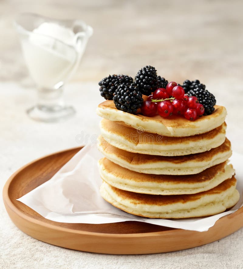 Stack of pancakes with fresh berries stock photography