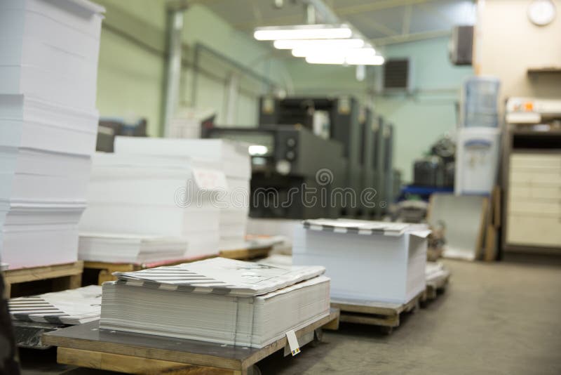 Stack of Paper in a Printing Press. Stock Photo Image of machine