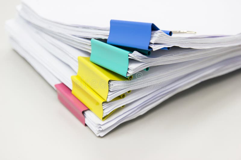 Stack Of Papers Documents In Archives Files With Paper Clips On Desk At Stack Of Papers Documents In Archives Files With Paper Clips On Desk At