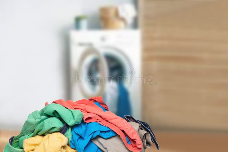 Stack or Pile of Colorful Dirty Clothes on Table Ready for the Laundry