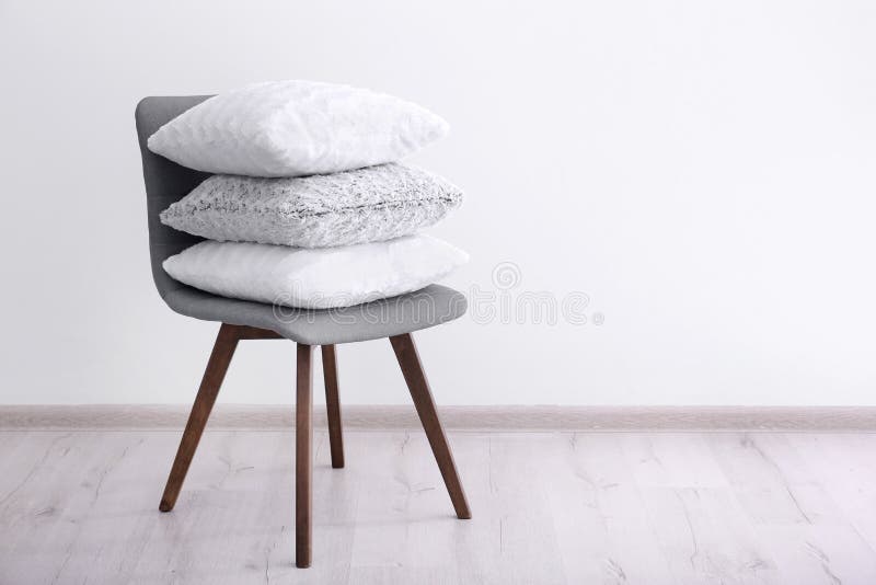 Stack of pillows on chair stock image. Image of lifestyle 112426557