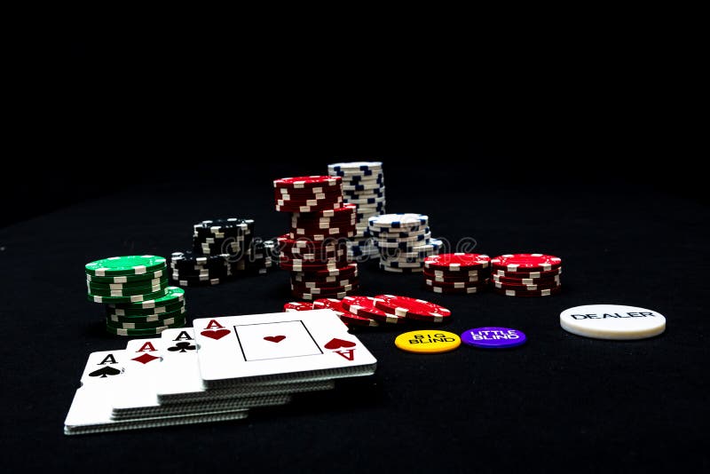 Stack of Poker Chips and Poker Cards on Black Background Stock Photo