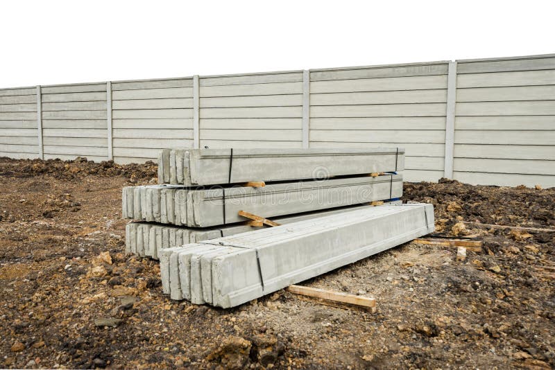 Stack of Precast Concrete Wall Panels on Fresh Ground Floor,to Build a Wall on the Construction