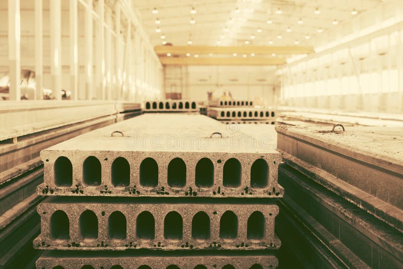 Stack of Precast Reinforced Concrete Slabs in a Factory Workshop Stock