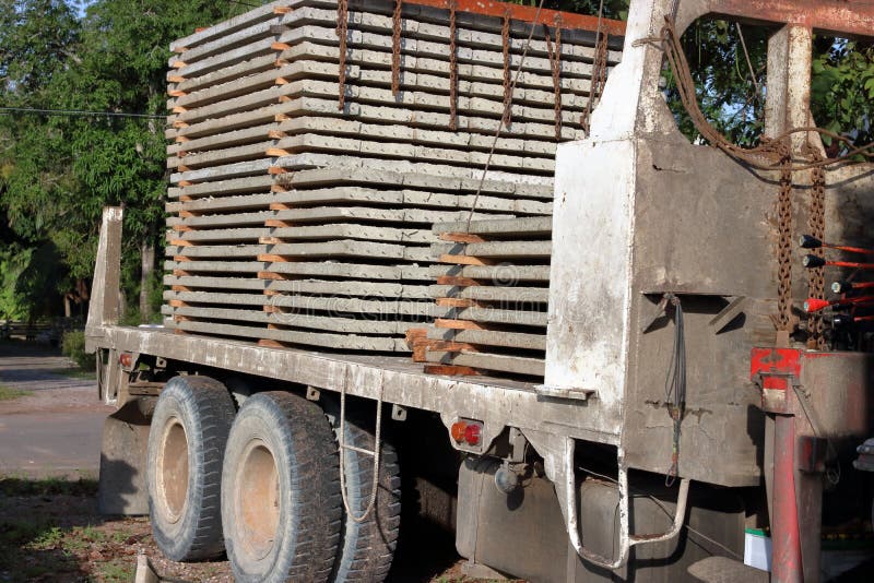 Stack of prestressed concrete slabs loaded on truck for construction, Side view royalty free stock photography
