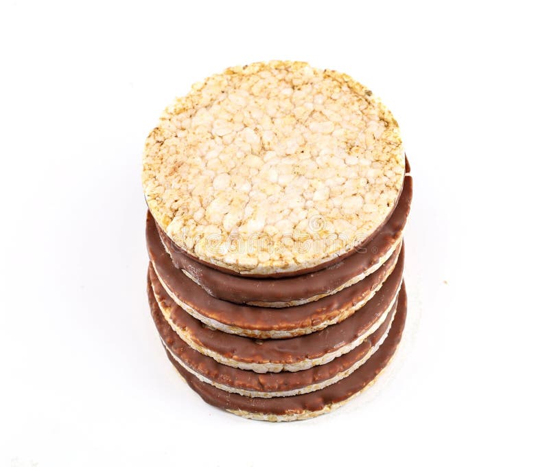 Stack of Puffed Rice Diet Crackers with Chocolate on White Background