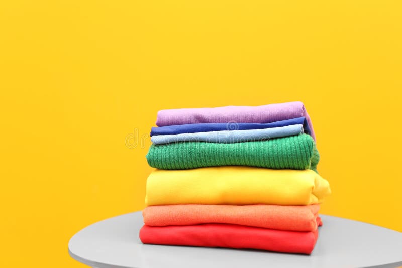 Stack of rainbow clothes on table royalty free stock images Stack of rainbow clothes on table royalty free stock images