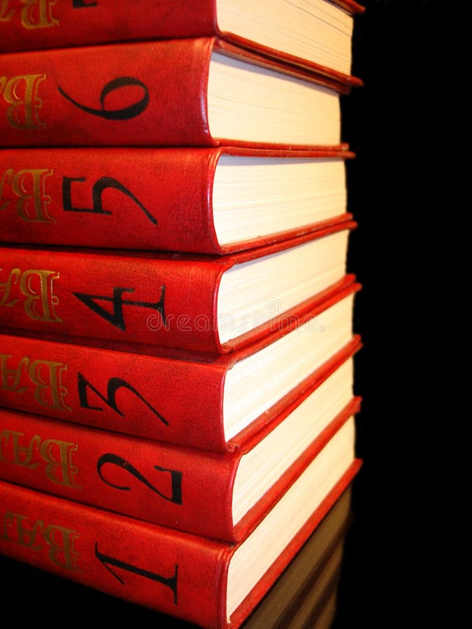 Stack of red books with numbers on black background