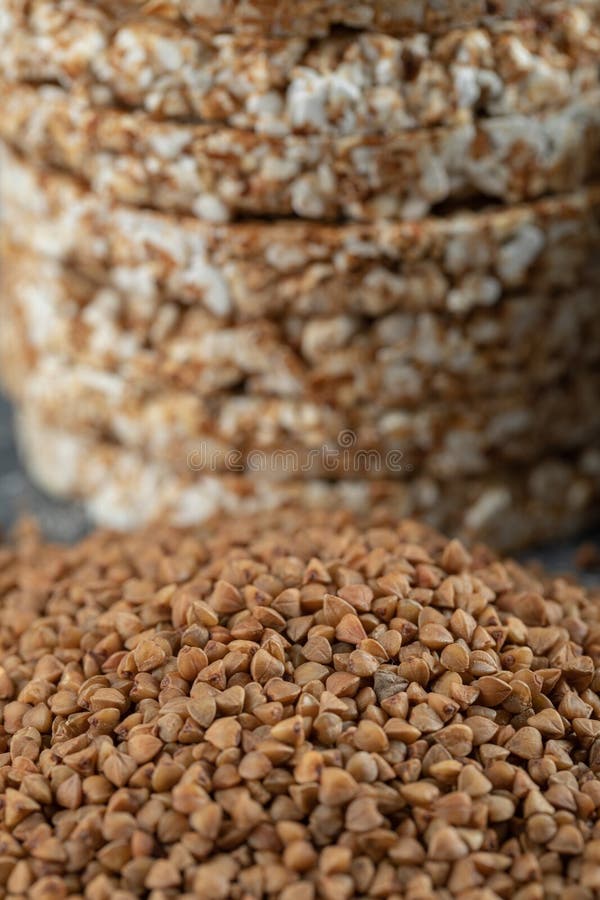 Stack of Rice Cakes and Pile of Buckwheat on Marble Surface Stock Image
