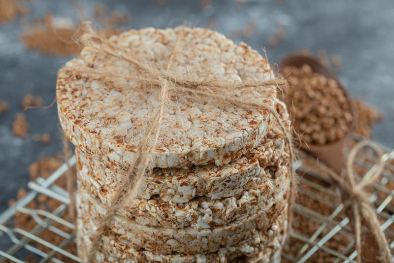 Stack of Rice Cakes and Scattered Buckwheat on Marble Surface Stock