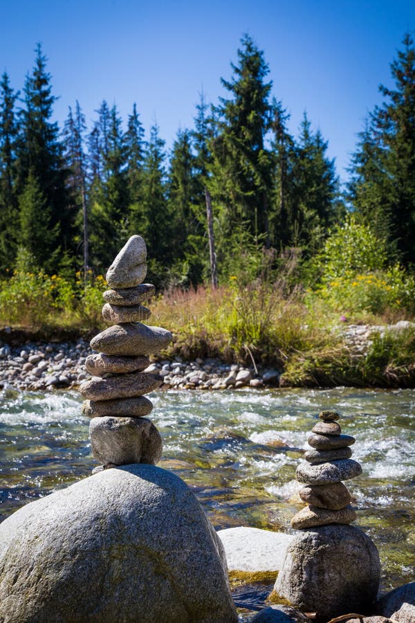 Stack of rocks at the bank of mountain river