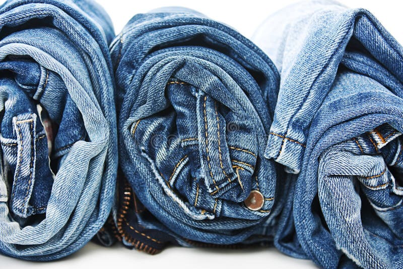 Stack of rolled jeans stock photo. Image of color, outfit - 65614490