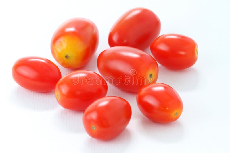 Stack of Roma Tomatoes isolated on white background, macro