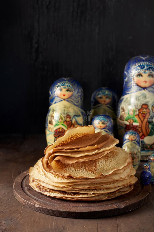 Stack of Russian Pancakes Blini and Traditional Wooden Dolls Matrioshka ...
