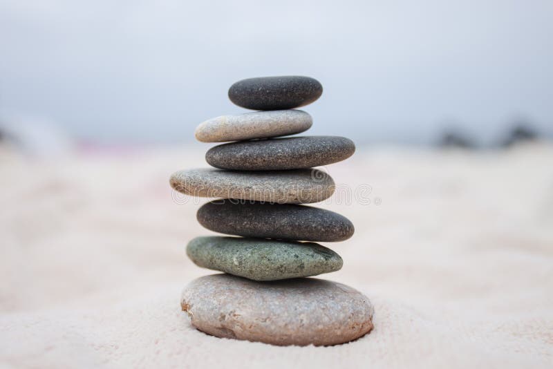 Stack of stones against seascape