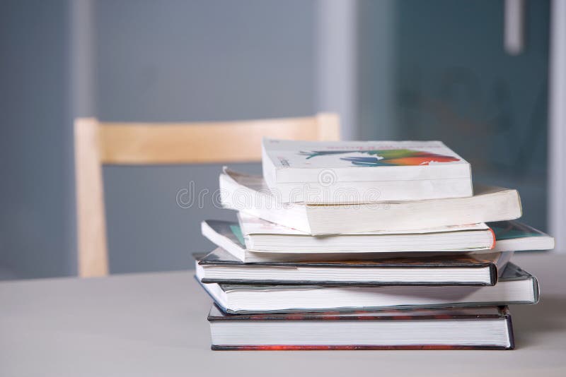 Stack of textbooks on a desk