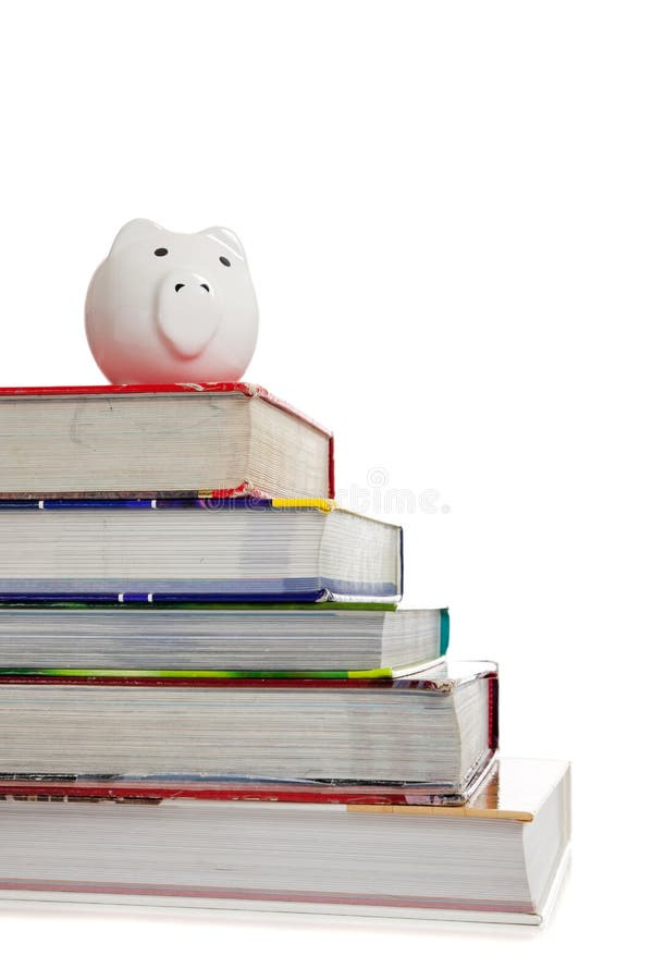 Stack of textbooks with a white piggy bank