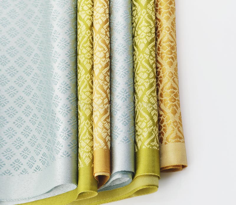 Stack of Thai fabric on white background