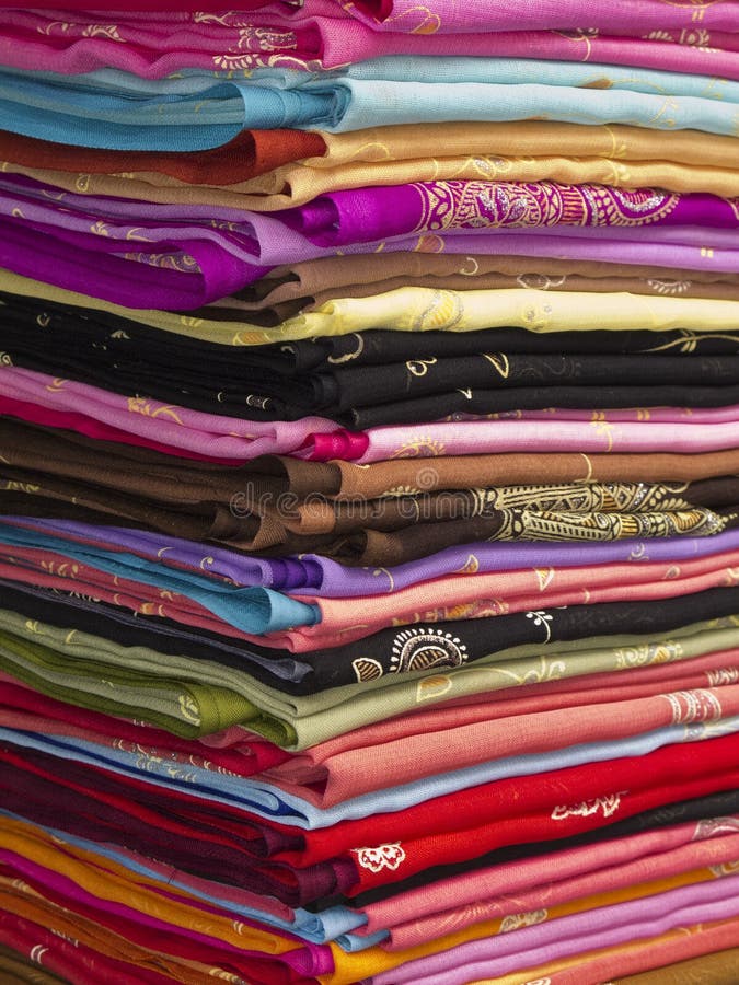 Thai silk material stacked ready for sale. Thai silk material stacked ready for sale.