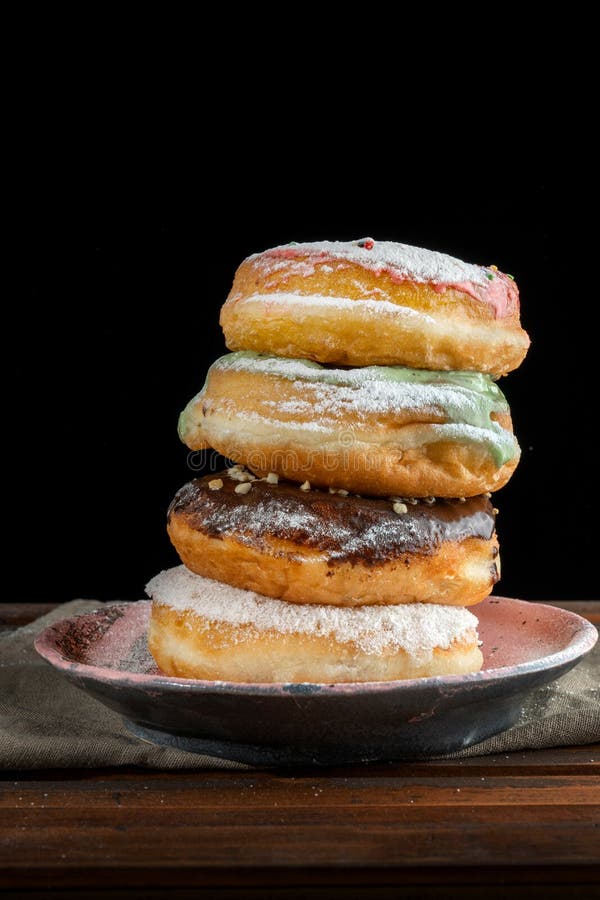 A Stack Of Two Donuts On Black Background. Stock Image Image of