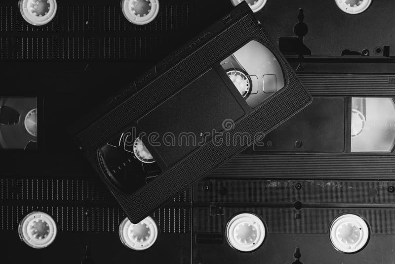 Stack of VHS Video Tapes As Background. Old Video Cassette Tapes. Stock