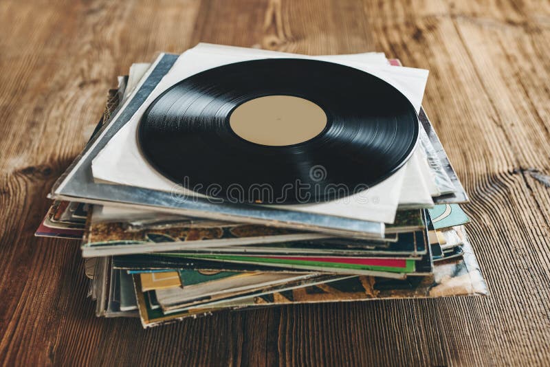 Stack of Vinyl Records. Listening To Music from Record. Playing Music