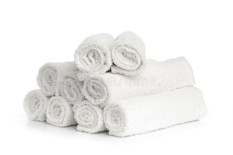 Stack of white clean towels rolled up on white background