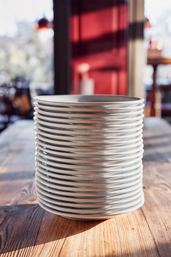 Stack of White Plates on the Wooden Table of a Restaurant or Cafe Stock Image Image of