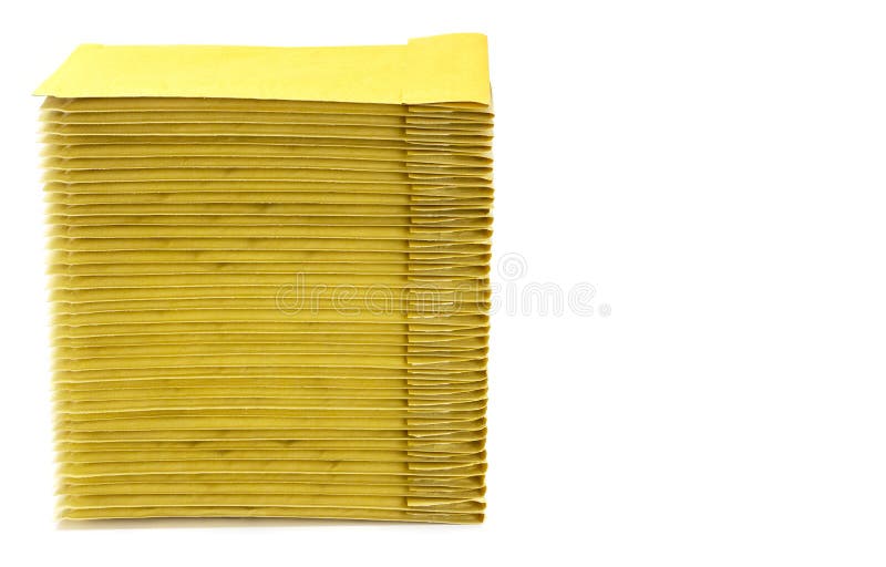 Stack of Yellow Padded Envelopes Isolated on White. Side View, Copy