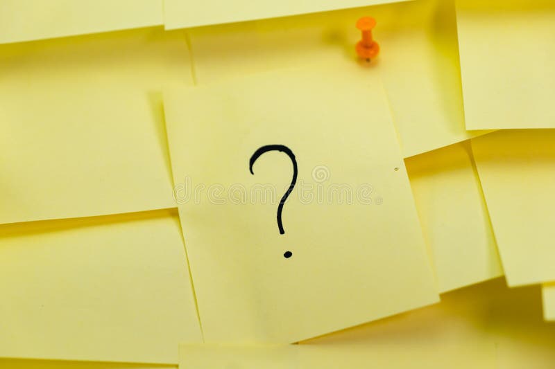 Stack of Yellow Sticky Notes with Question Marks stock image