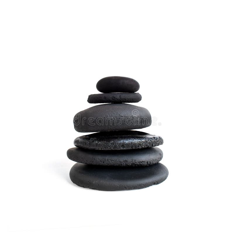 Stacked black stones. Balancing pebbles isolated on white background