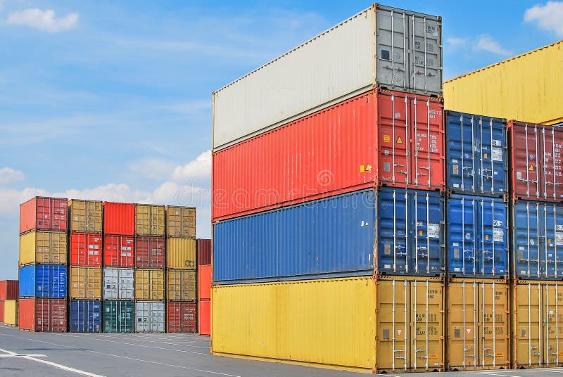 Stacked cargo containers in storage area of freight sea port terminal royalty free stock photo