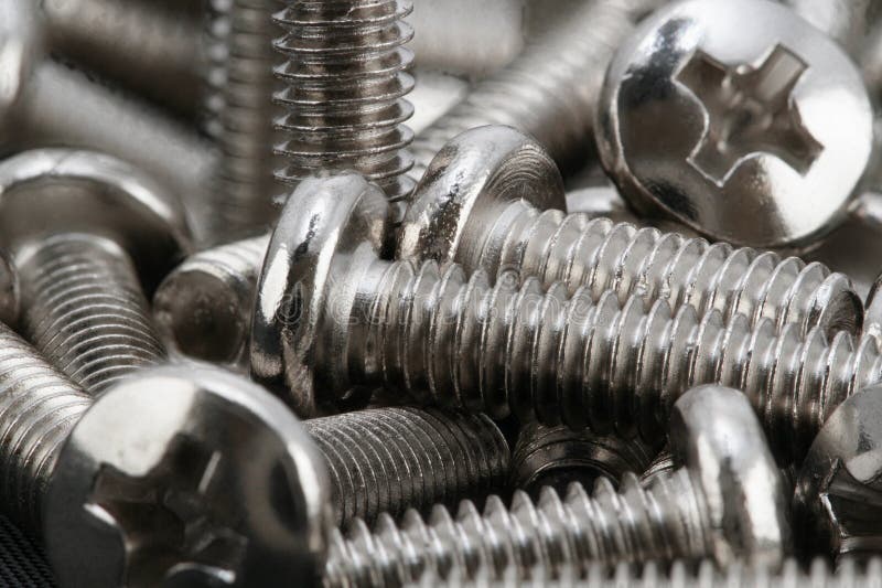 Stacked of chrome bolts stock image. Image of industry 55241425