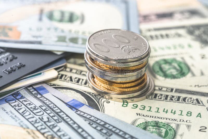 Stacked Coins and Bank Cards and Credit Cards are Placed on the Spread