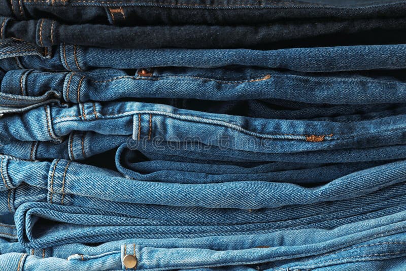 Stacked Jeans of Different Colors Stock Image - Image of backdrop ...