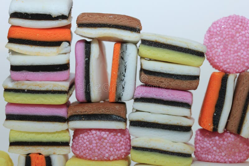 Stacked liquorice allsorts stock image. Image of orange 221609331