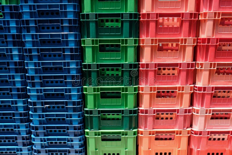 Stacked Multicolored Old Plastic Baskets Background Stock Photo
